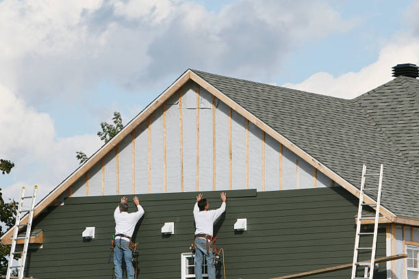 Professional Siding technician working in Patchogue, NY